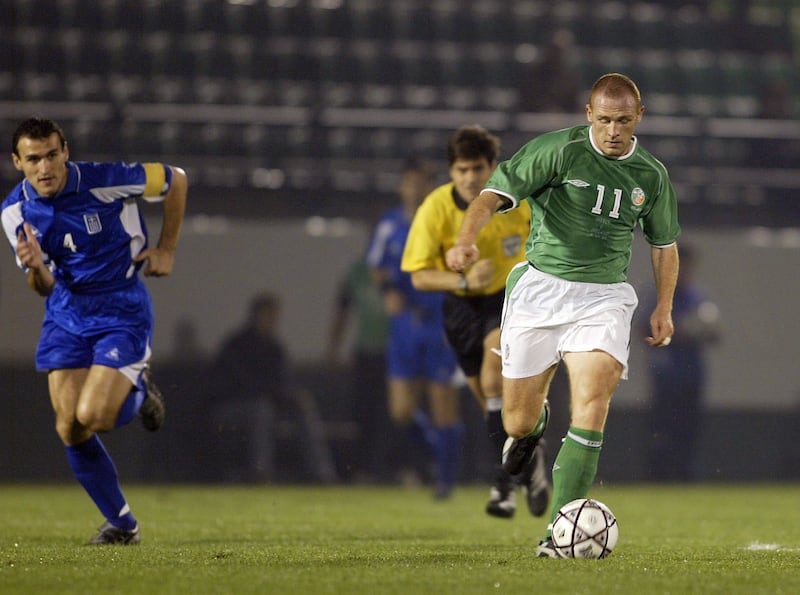 Glen Crowe of the Republic of Ireland is chased by Nikolas Dabiazas of Greece during the friendly match between the teams at the Apostolos Nicolaidis Stadium, Athens in 2002. Photograph: Mark Thompson/Getty Images