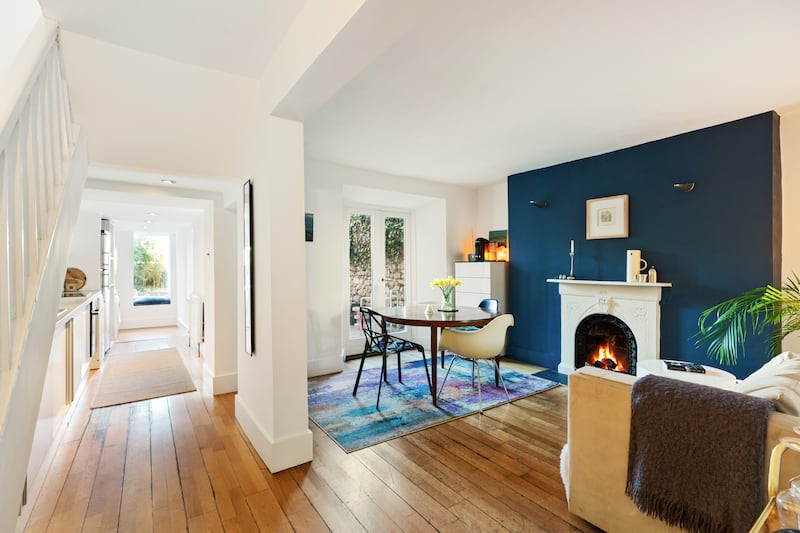 To the rear, adjacent to the kitchen, is a cosy living/diningroom with French doors leading out to the back garden.