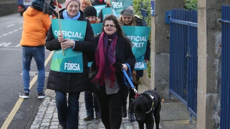 Staff in health and social care organisations striking on Friday. Forsa held a media event at the National Council for the Blind on Whitworth Road. Audrey Tormey (centre), shop stewart, NCBI and her guide dog Zorro take part. Photograph: Nick Bradshaw/The Irish Times