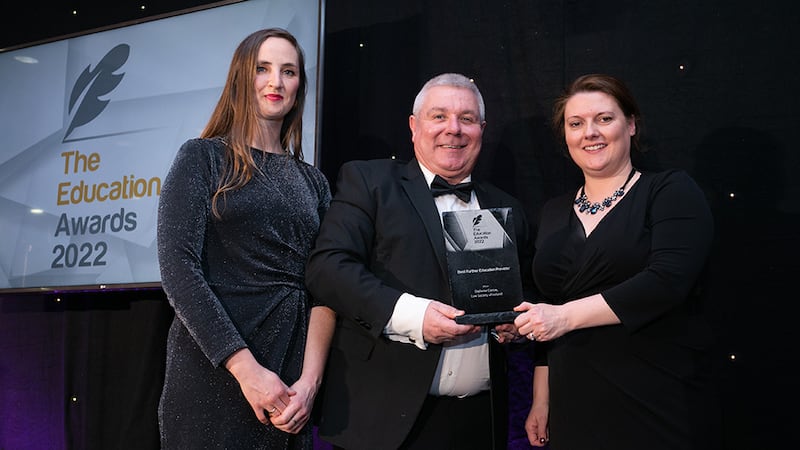 Gerard O'Donovan, Awards Judge, presents the Best Further Education Provider Award to Claire O'Mahony and Odette O'Reilly, Law Society of Ireland.