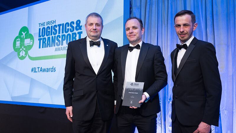 Martin Kelly, Associate Director, AIB Corporate, presents the Green Impact Award to Will Campbell and Martin Madine, Translink.