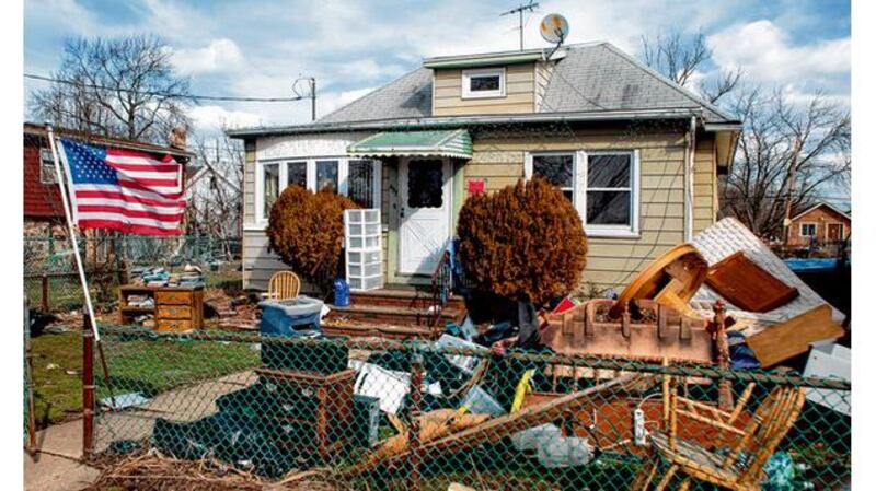 A house damaged by Sandy in Staten Island. photographs: barry cregg, new york times