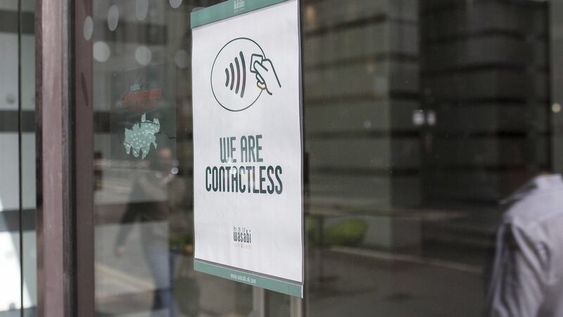 A ‘We Are Contactless’ sign at a Wasabi sushi restaurant in London. Photograph: Simon Dawson/Bloomberg via Getty Images