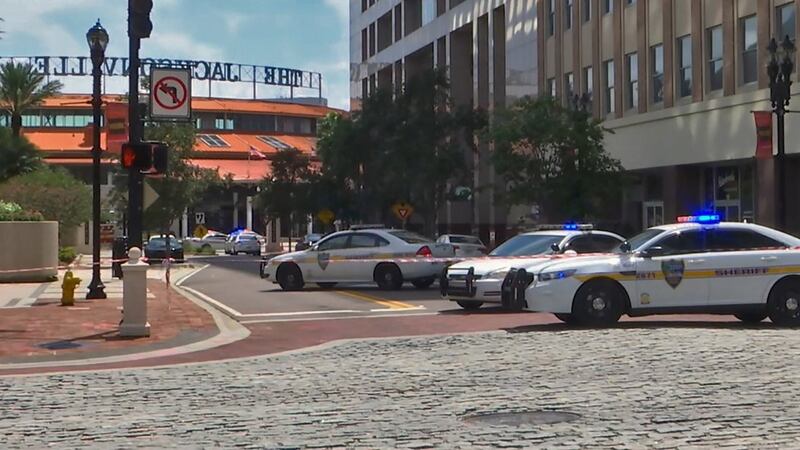 This handout image distributed courtesy of WJXT, a local Jacksonville television station, shows police cars blocking a street leading to the Jacksonville Landing area in downtown Jacksonville, Florida. Photograph: Getty Images