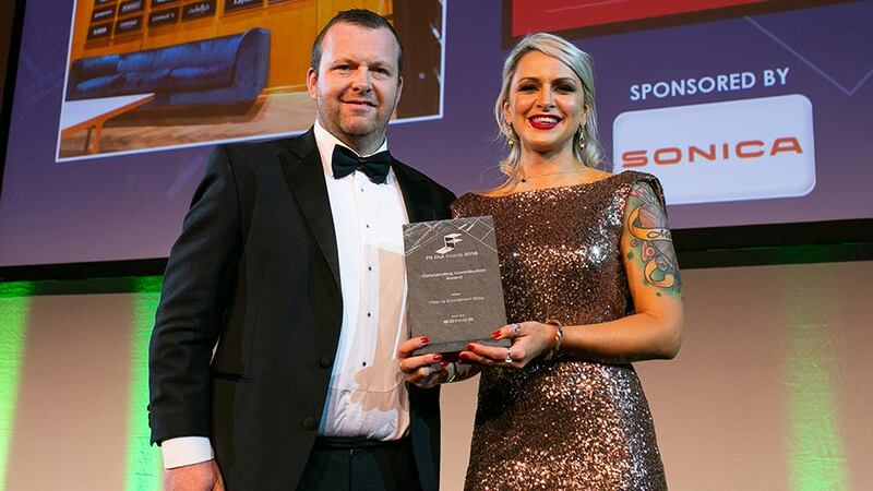 Tamara Howard, Brand & Bid Manager, SONICA presents the Outstanding Contribution Award to Matt Ryan, Press Up Entertainment Group.