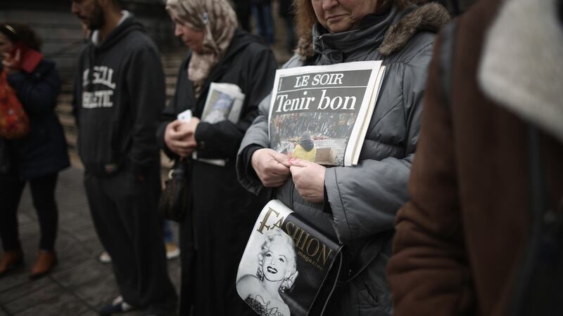 People pay their respects to the victims and injured at The Place de la Bourse in Brussels, Belgium. Photograph: Getty