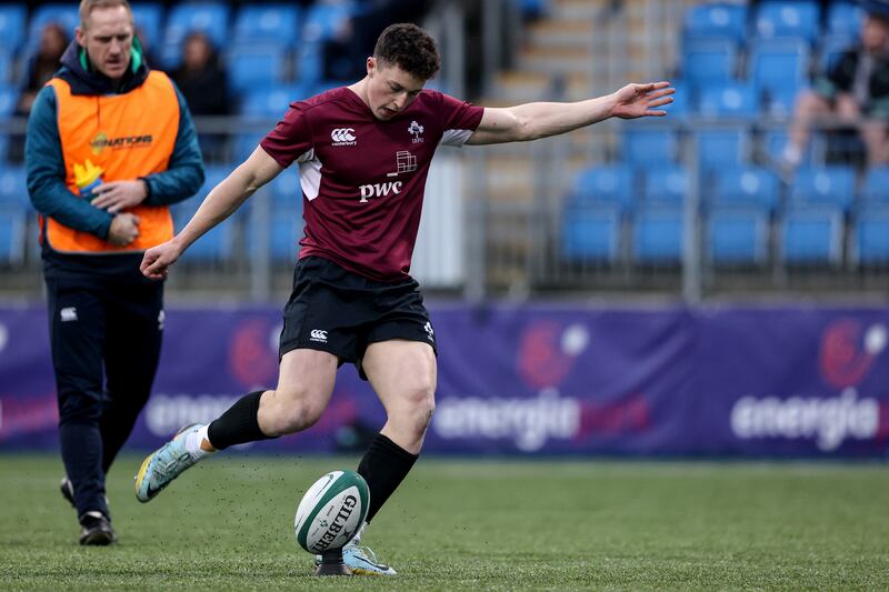 Ireland's Harry West takes a kick. Photograph: Ben Brady/Inpho