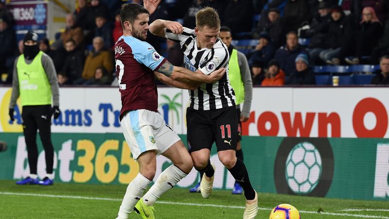 Matt Ritchie - pictured being tackled by Burnley’s Robbie Brady - missed a golden chance to extend Newcastle’s lead at Turf Moor. Photograph: Paul Ellis/AFP