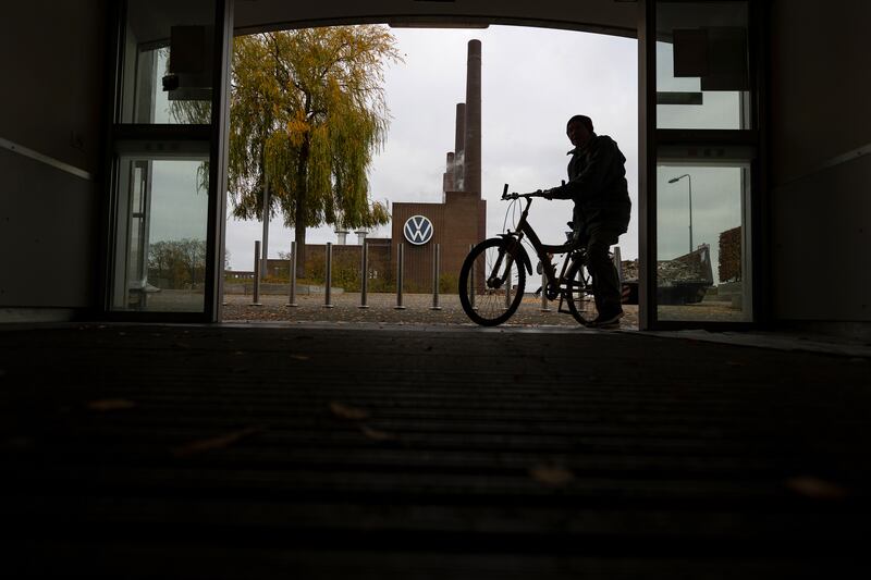 A worker passes the Volkswagen factory's power plant in Wolfsburg. Photograph: Krisztian Bocsi/Getty