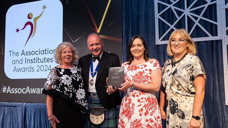 Steve Mungavin, awards judge, presents the equality, diversity & inclusion champion awards to Women in Finance Charter Team