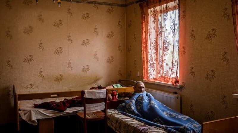 Men lie in bed in a nursing home in Chasiv Yar, Donetsk region. Photograph: Ed Ram/The Guardian