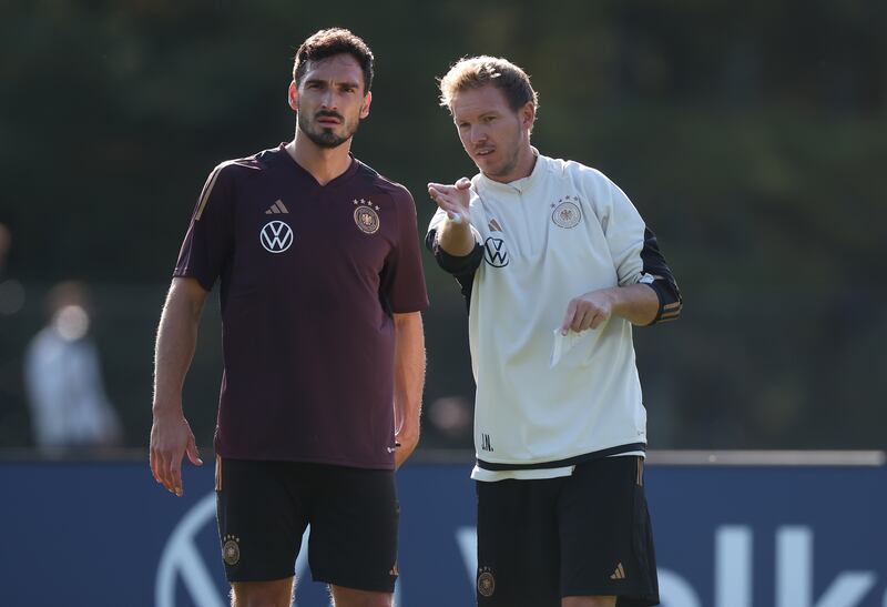 Julian Nagelsmann, head coach of Germany, giving instructions to Mats Hummels during a training session of the German national football team on October 10th, 2023. Photograph: Alex Grimm/Getty Images