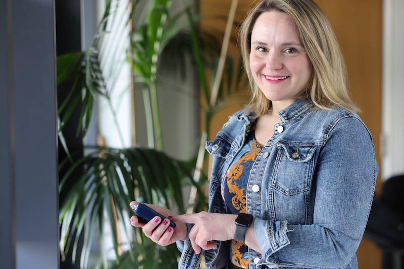 Dr Kate Gajewska, clinical manager for advocacy and research at Diabetes Ireland, with a wearable system that incorporates a continuous glucose monitor with an automated insulin pump. Photograph: Dara Mac Dónaill