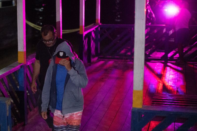 A suspected arrested for the murder of indigenist Bruno Prereira and journalist Dom Phillips arrives by boat in the port of Atalaia do Norte, state of Amazonas, Brazil on Sunday. Photograph: Joao Laet / AFP/Getty Images