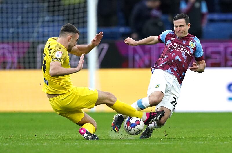 Preston North End's Ben Whiteman (left) and Burnley's Josh Cullen battle for the ball during a Championship match at Turf Moor, Burnley. on February 11th, 2023. Photograph: PA