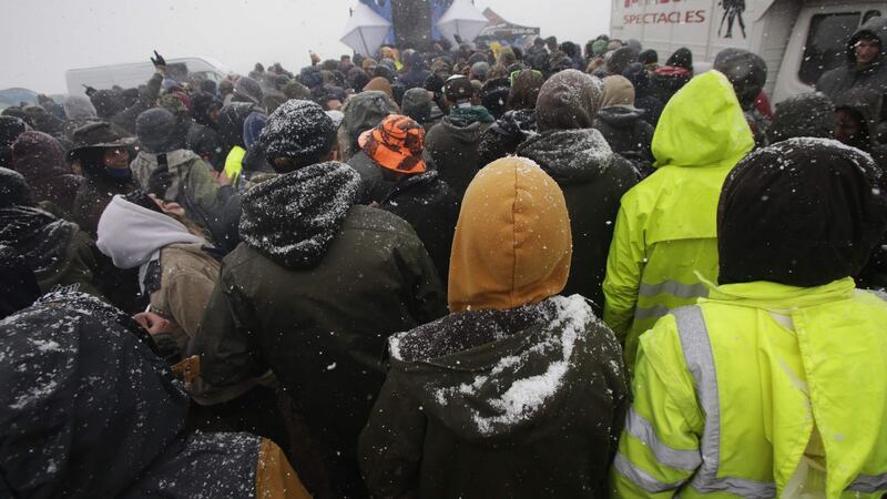 Participants of the Teknival techno music festival as snow falls. Photograph: PASCAL LACHENAUD/AFP/Getty Images