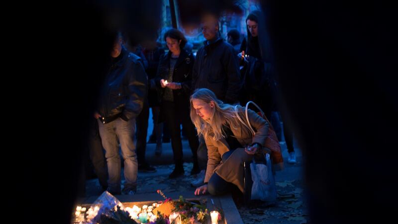 Mourners outside the Bataclan in Paris on November 16th, 2015. Isis propagandist Fabien Clain, believed to have recorded the claim of responsibility for the attacks, was killed by an air strike in Syria. Photograph: Tyler Hicks/New York Times