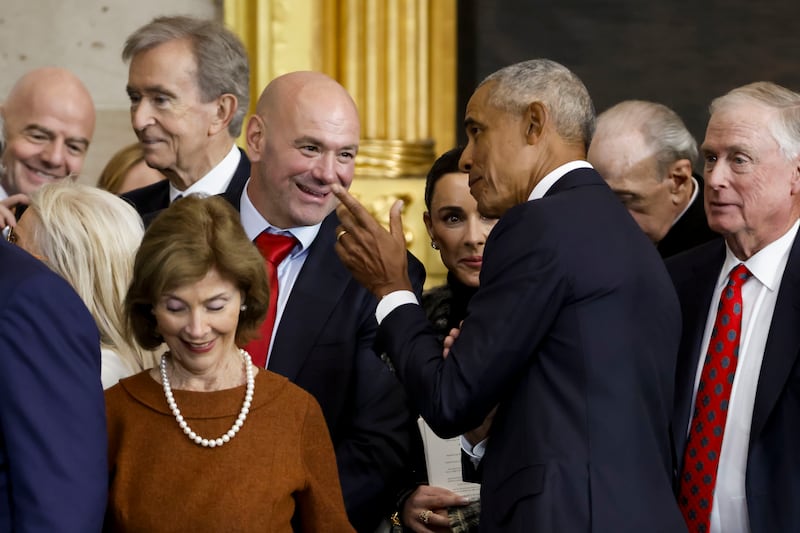 Former US president Barack Obama speaks with UFC CEO Dana White, with former US first lady Laura Bush also pictured, after the inauguration of President Donald Trump. Photograph: Shawn Thew/Getty Images