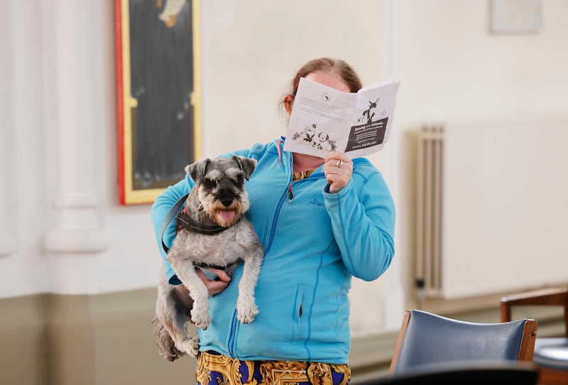 Angelín Fanning with her dog Anam Cara at the service. Photograph: Alan Betson