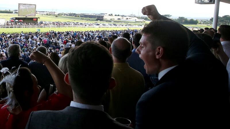 Racegoers celebrate at the Galway Races in August. Attendances this year were 39% short of the 2006 peak. Photograph: Tommy Dickson/Inpho