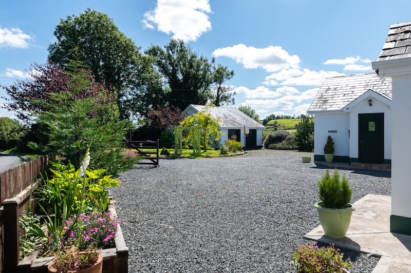 The property has well stocked gardens, a glass house and raised vegetable beds