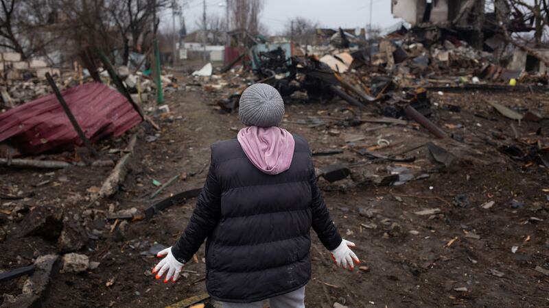 Natalia Hrom reacts to the destruction in her village in Svitylnia, Ukraine. Photograph: Anastasia Vlasova/Getty Images