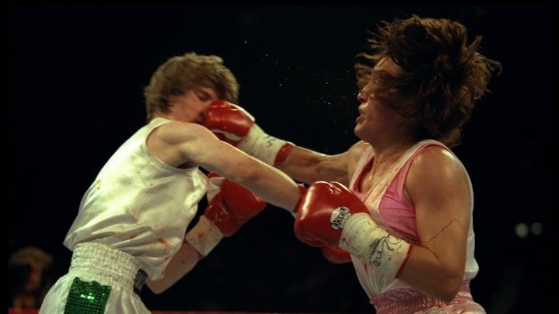 Deidre Gogarty and Christy Martin trade blows during their fight in Las Vegas. Photograph: Al Bello/Allsport