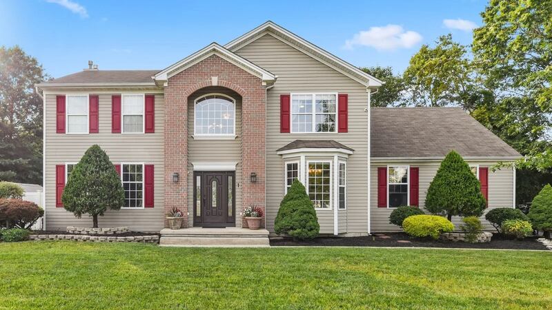 This New Jersey colonial-style home lies  on over an acre