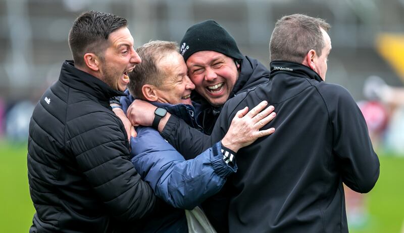 Clare manager Colm Collins celebrates winning with his backroom team. Photograph: Natasha Barton/Inpho