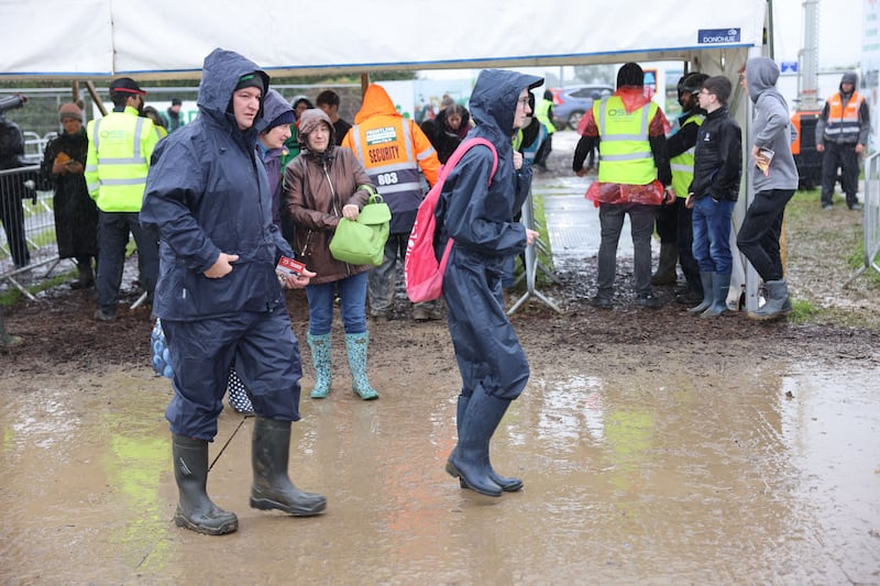 Waterproof overalls and jackets were equally as popular as the wellington boots. Photograph: Dara Mac Dónaill/The Irish Times