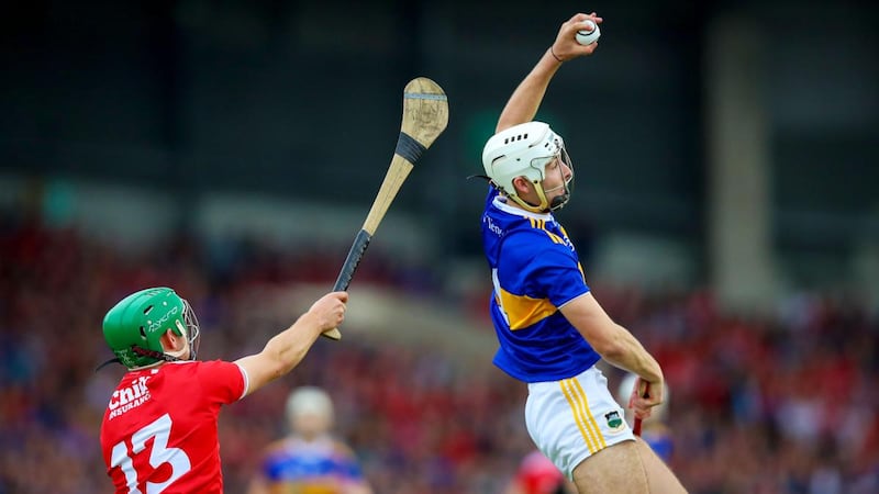 Cork’s Brian Turnbull challenges Tipp’s Craig Morgan. Photograph: Tommy Dickson/Inpho