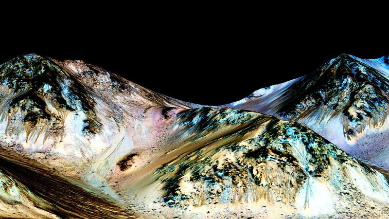 Scientists believe flowing liquid water is almost certainly responsible for mysterious features on Mars that change with the seasons. Photograph: PA