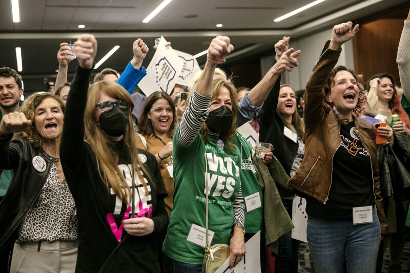 A group at an Ohioans United for Reproductive Rights watch party on election night celebrate the vote in favor of a state constitutional amendment enshrining the right to abortion, in Columbus, Ohio. Photograph: Maddie McGarvey/The New York Times
                      