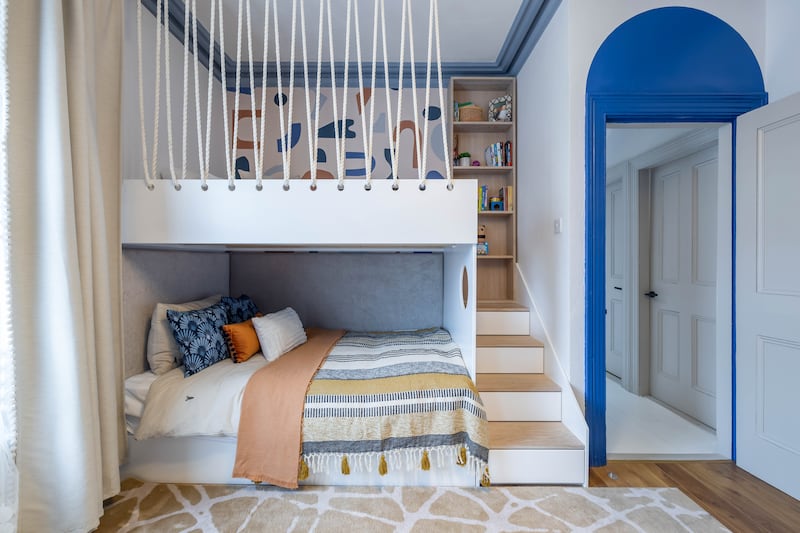 A very smart use of colour and customised joinery to create bespoke bunk beds with an arch of Tikkurila navy blue drawing attention to the period ceiling heights