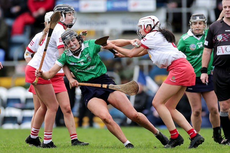 Sarsfields' Niamh McGrath with Amy Boyle and Claire McKillop of Loughgiel Shamrocks during the All-Ireland club semi-final. Photograph: Inpho/Laszlo Geczo