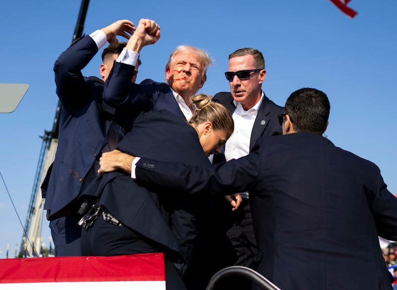 A bloodied Donald Trump after shots were fired at a campaign rally in Butler, Pennsylvania. Photograph: Doug Mills/The New York Times
                      