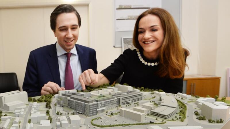 Minister for Health Simon Harris  and National Maternity Hospital (NMH) master Rhona Mahony with a model of the proposed new NMH at the St Vincent’s hospital campus in Dublin. Photograph: Cyril Byrne