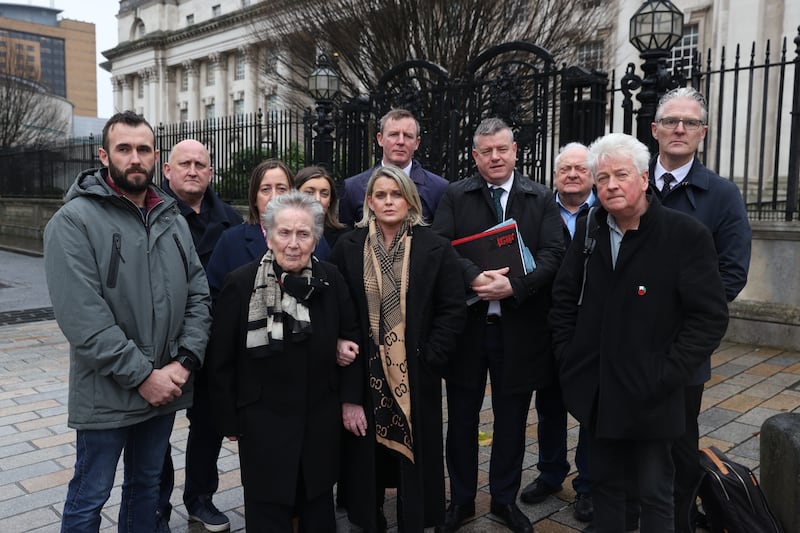 Seán Brown's grandson Daman Quinn, son Seán Brown, daughter Siobhán Brown, widow Bridie Brown, daughter Claire Loughran, solicitor Justin McNulty, supporter Niall Murphy and supporter Jarlath Burns outside the High Court in Belfast. Photograph: Liam McBurney/PA Wire