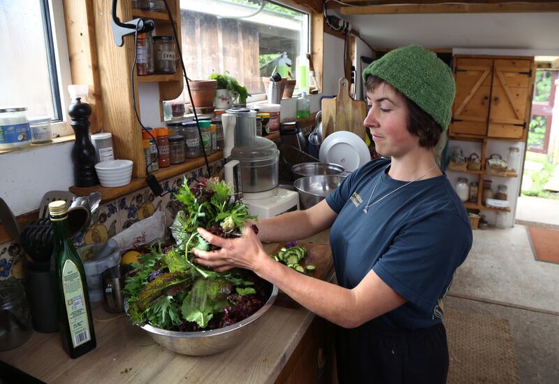 Florence preparing salad for a meal at the farm. Photograph: Joe O’Shaughnessy 