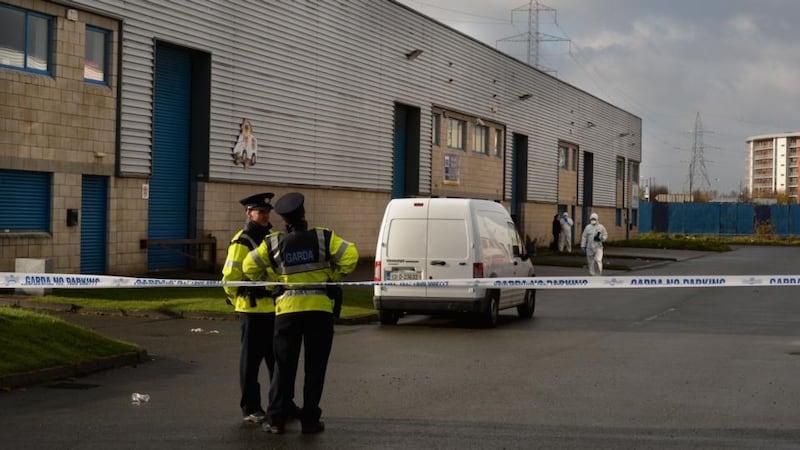 Gardaí at the scene in Ballyfermot, Dublin today. Photograph: Dara Mac Dónaill/The Irish Times