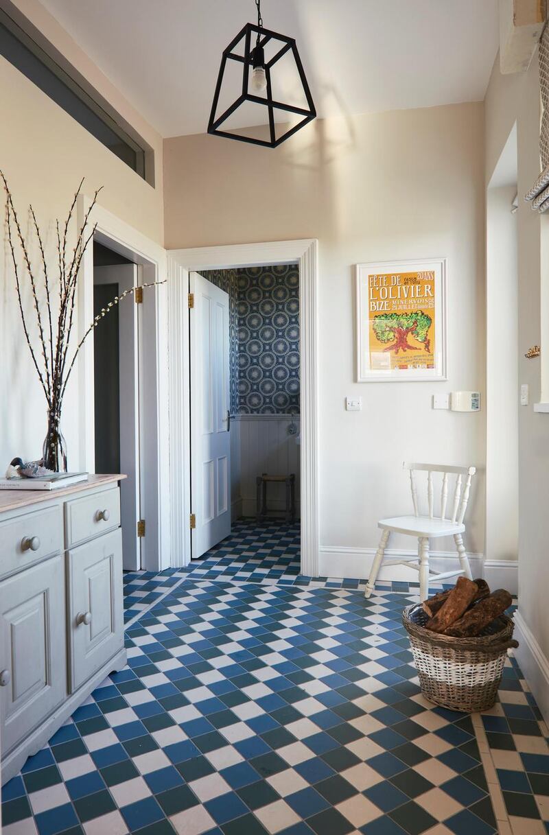 Hallway.tiling,side cabinet,wall mirror.pendant light Photograph by Philip LauterbachPhotographs by Philip Lauterbach