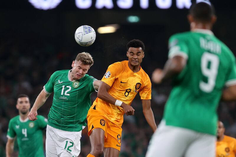 Ireland's Nathan Collins and Cody Gakpo of Netherlands. Photograph: Bryan Keane/Inpho