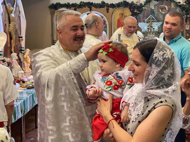 Fr Vasily Vyrozub performs a blessing. Photograph: Ed Vulliamy