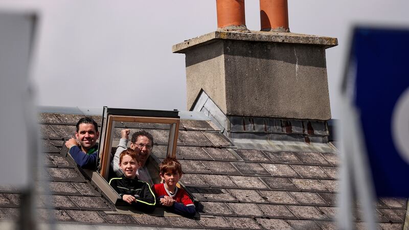 Some fans watch from their home. Photo: Tommy Dickson/Inpho