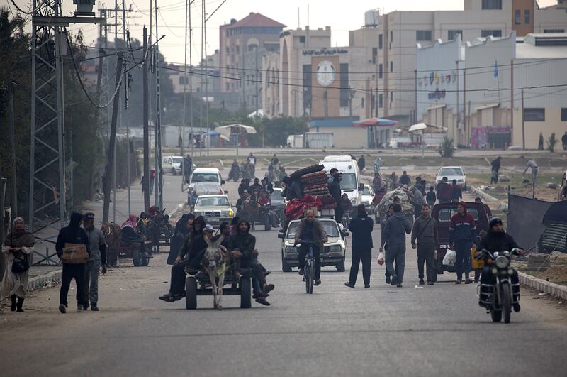 Displaced Palestinians from the Nuseirat, Bureij and parts of the Khan Younis refugee camps, make their way to the city of Rafah after an Israeli warning of increasing military operations in the Gaza Strip camps. Photograph: Haitham Imad/EPA