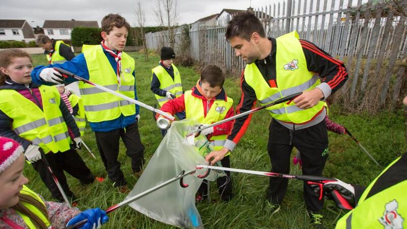 Munster and Ireland rugby star Conor Murray joins volunteers for the Limerick clean-up in Corbally in Co  Limerick. Photograph: FusionShooters