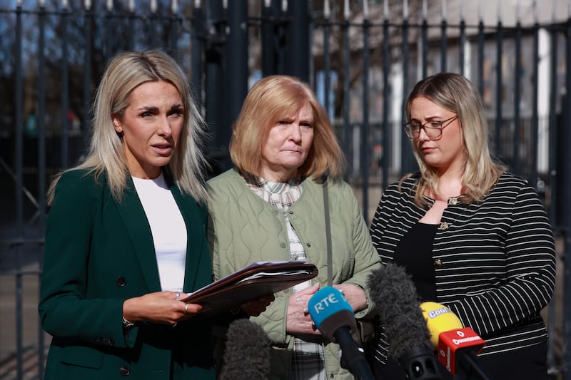 The foster mother (centre) of Oliver Rowland, stands next to PSNI Detective Chief Inspector Kerrie Foreman (left) from the PSNI's major investigation team. Photograph: Liam McBurney/PA Wire