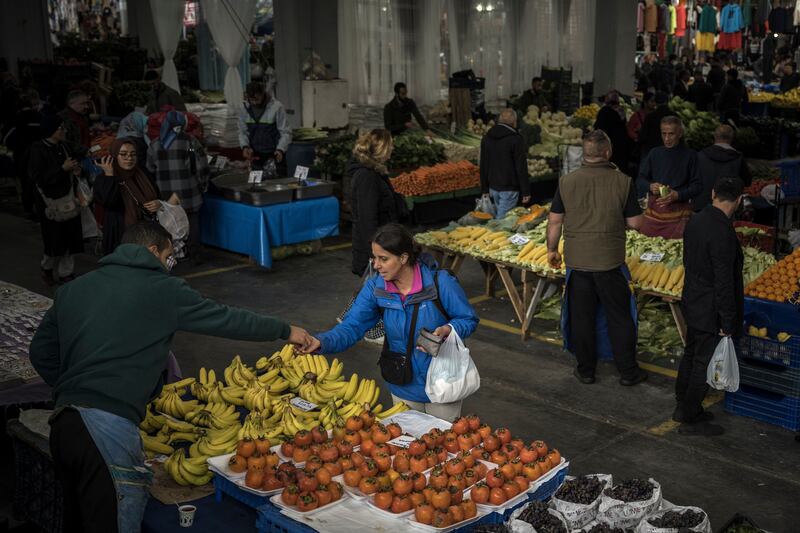  Shoppers at a food market in Istanbul. Turkey’s peak inflation rate in 2022 was the second-highest among the Group of 20 largest economies, after Argentina. Photograph: Sergey Ponomarev/New York Times