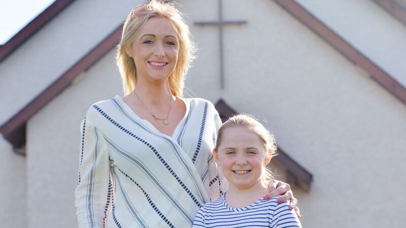 Bronwyn Cuddy with her daughter, Claudia, who will be making her communion this year at St Edmund’s Church, Castletown, Co Laois. Photograph: Alan Betson