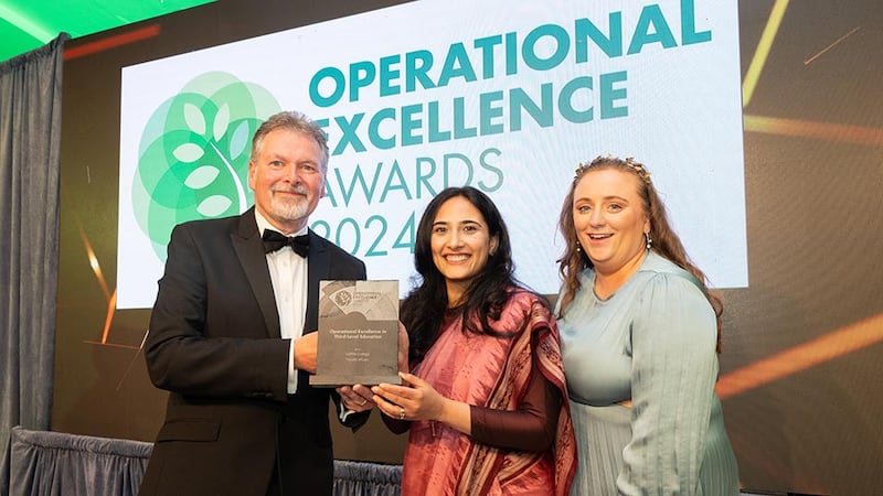 Sean Mc Auliffe, director of specialised services at ISS Ireland, presents the operational excellence in third-level education to Dr Ruhi Anand and Karen Sutton, Griffith College